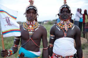 Marcy Mendelson, The Samburu Story | Samburu moran (warriors) celebrate their graduation into 'senior' moran status of the Loimisi clan. Outside Kisima village, Samburu, Kenya.