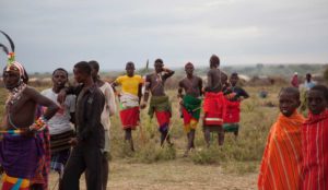 Marcy Mendelson, The Samburu Story | Samburu moran (warriors) relax and celebrate following their graduation ceremony into senior warrior status. Outside Kisima village, Samburu, Kenya. August 22, 2013.