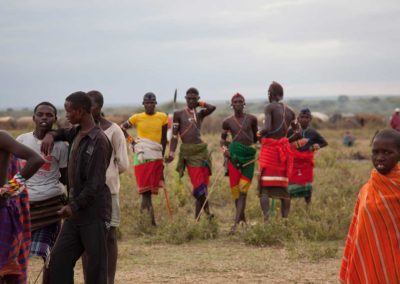 Marcy Mendelson, The Samburu Story | Samburu moran (warriors) relax and celebrate following their graduation ceremony into senior warrior status.  Outside Kisima village, Samburu, Kenya.  August 22, 2013.